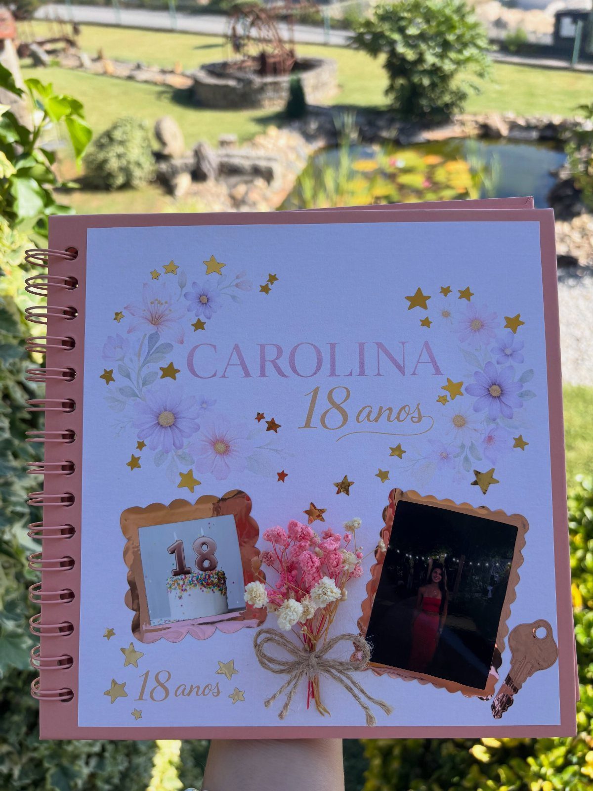 Personalized 18th birthday photo album with floral decorations and small dried flowers.