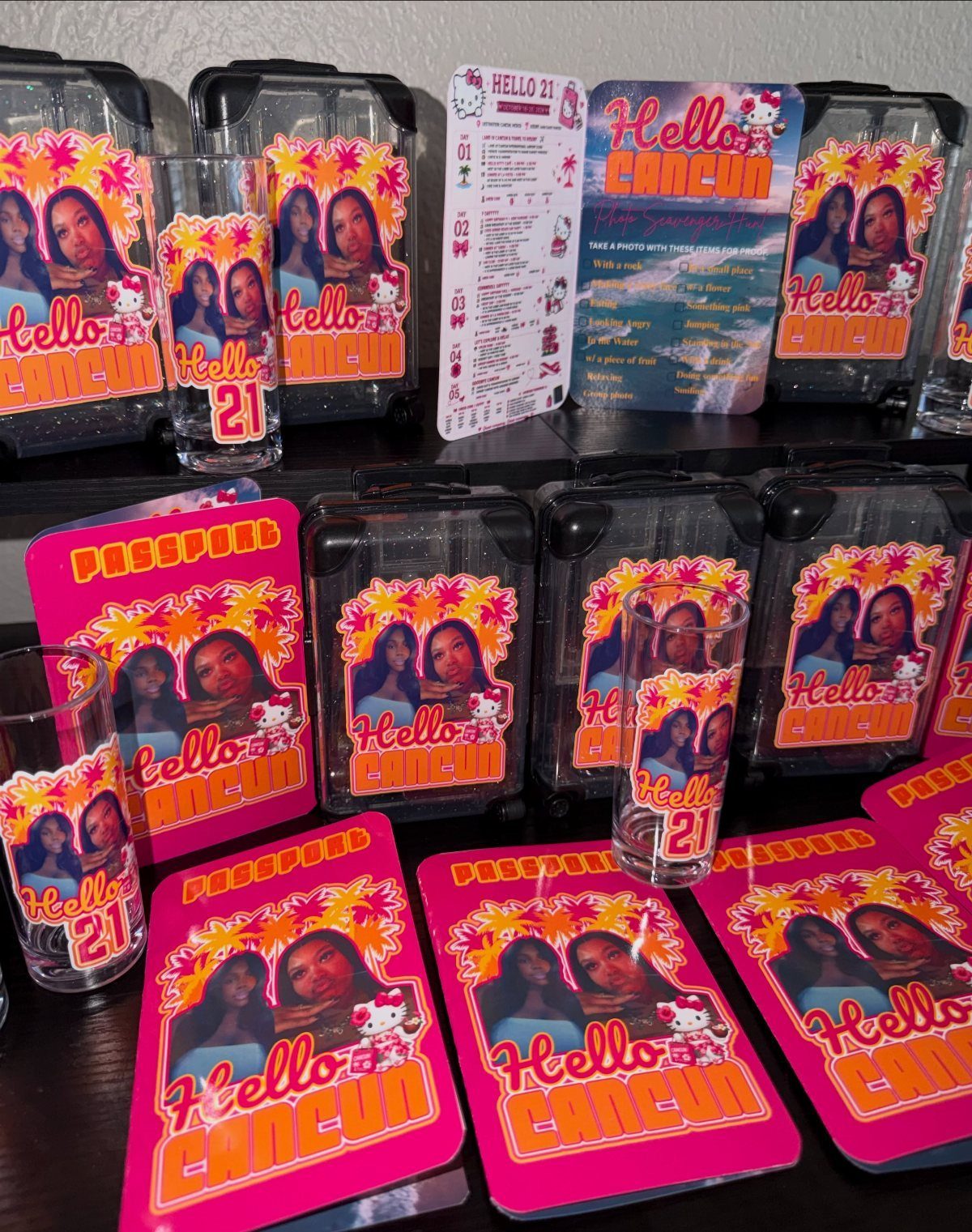 Matching pink passport covers and glasses with photos for a 21st birthday trip.