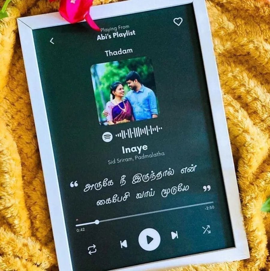 Couple's song photo frame with a couple's picture and music player interface.