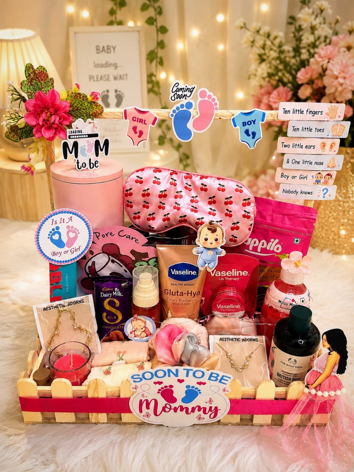 Baby shower gift basket with skincare, sleep mask, and 'Soon to be Mommy' sign.