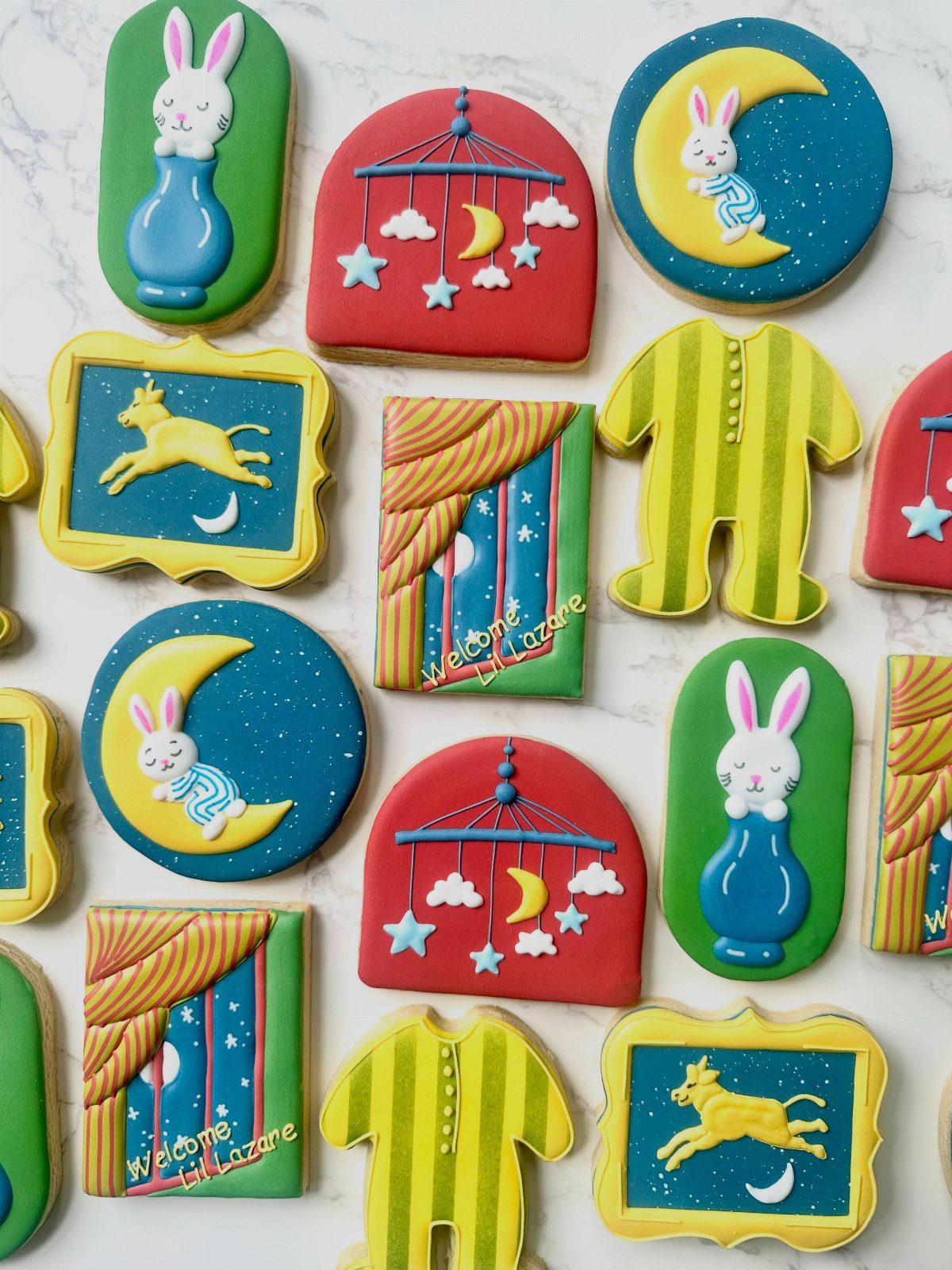 Decorated sugar cookies featuring characters and scenes from the book Goodnight Moon.