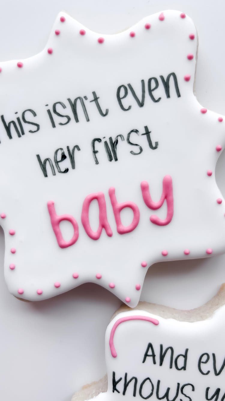 Frosted sugar cookies with pink dots and text about a second baby.