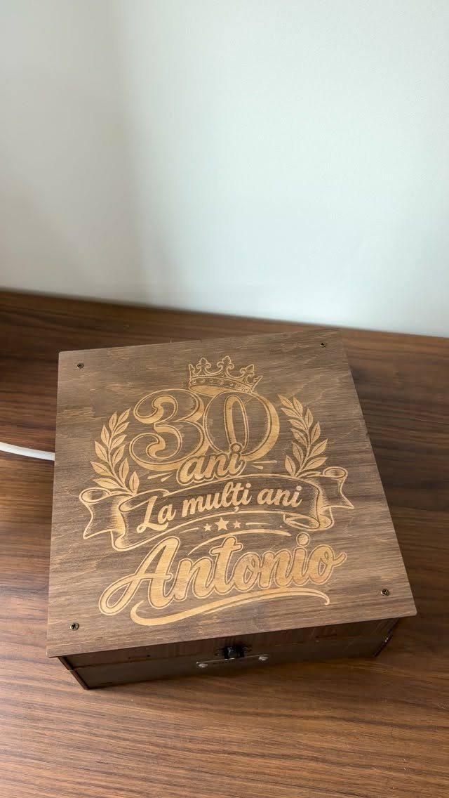Engraved wooden gift box for Antonio's 30th birthday on a wooden table