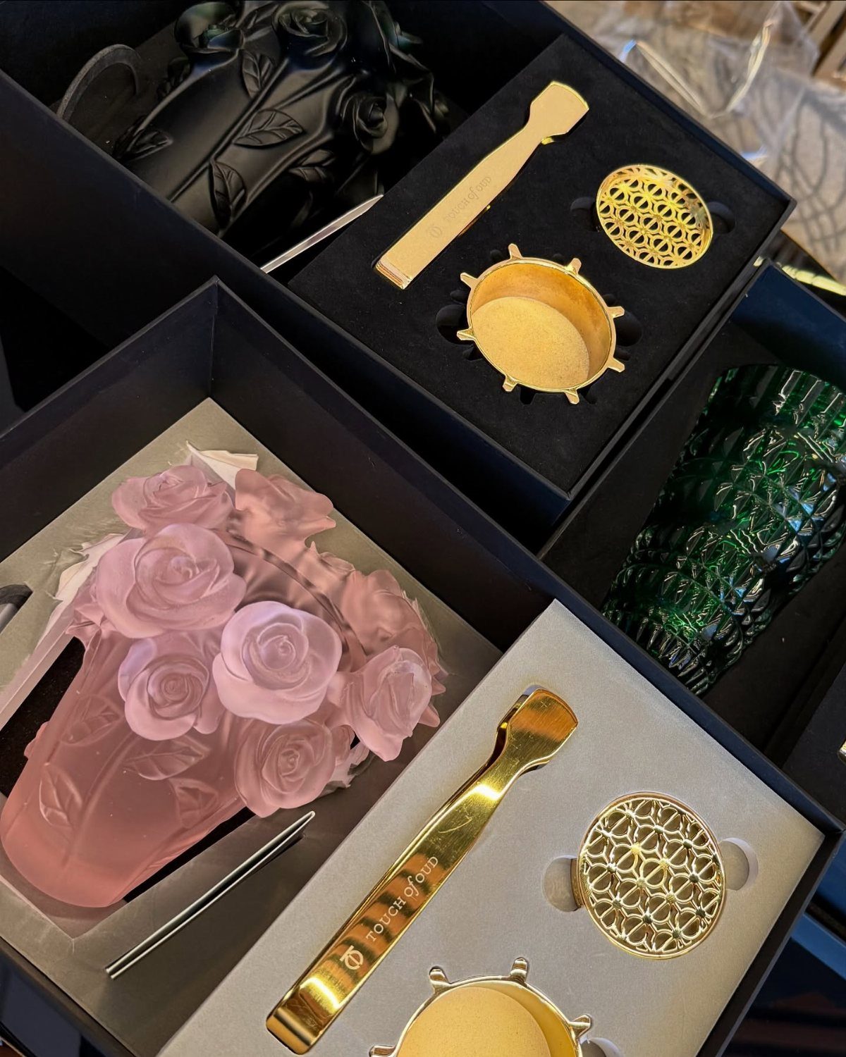 Decorative candle gift sets with rose-shaped candles and gold metal accessories in black boxes
