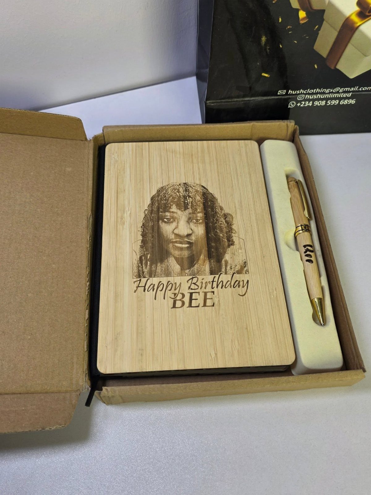 Wooden personalized notepad with engraved portrait and birthday message in a gift box