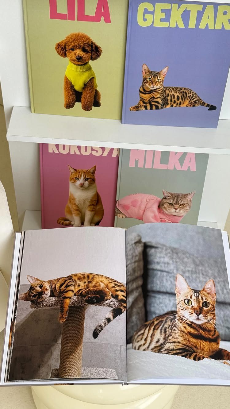 Personalized pet books featuring cats and dogs on colorful covers and open pages.
