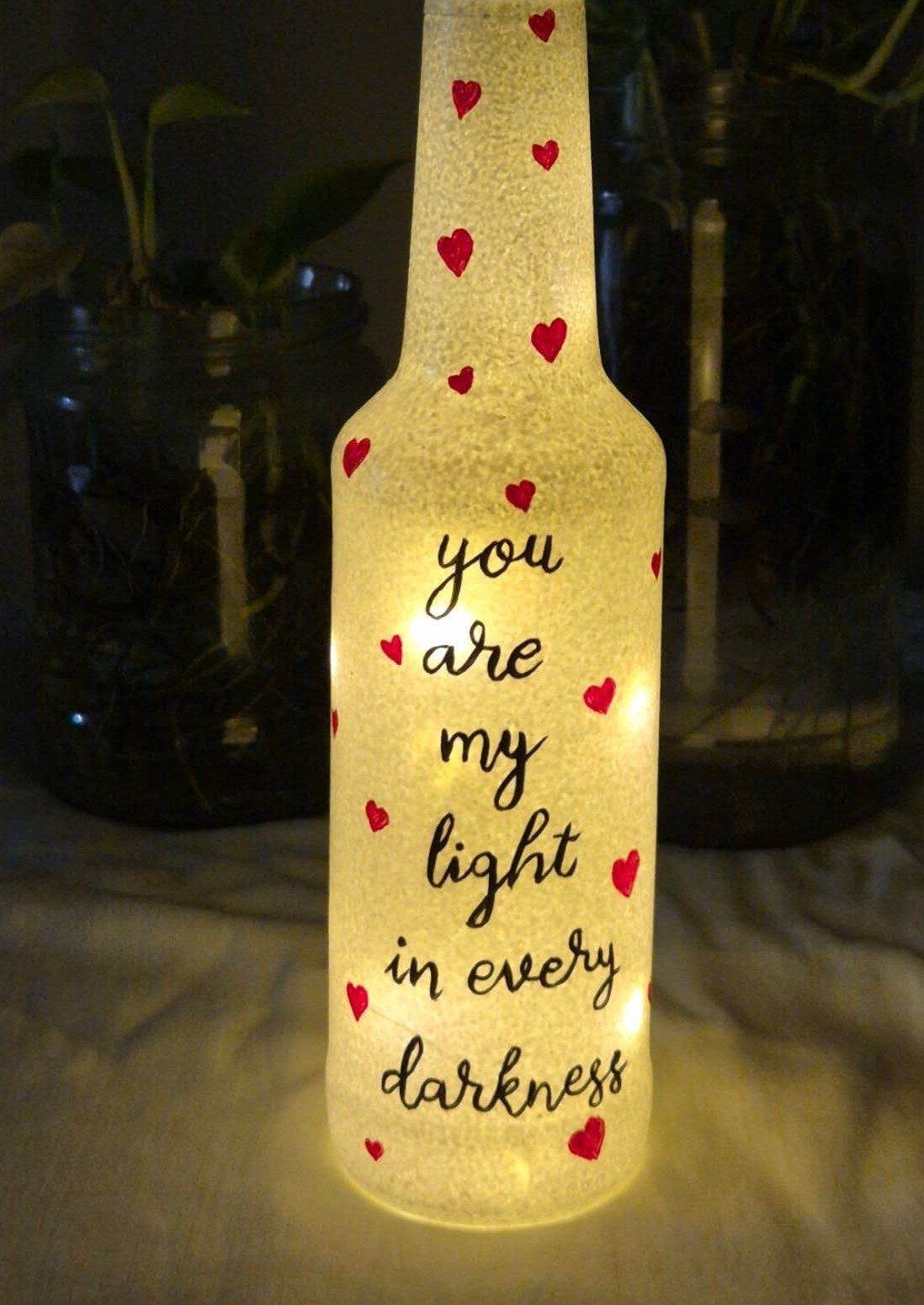Frosted glass bottle lamp with red hearts and romantic handwritten text