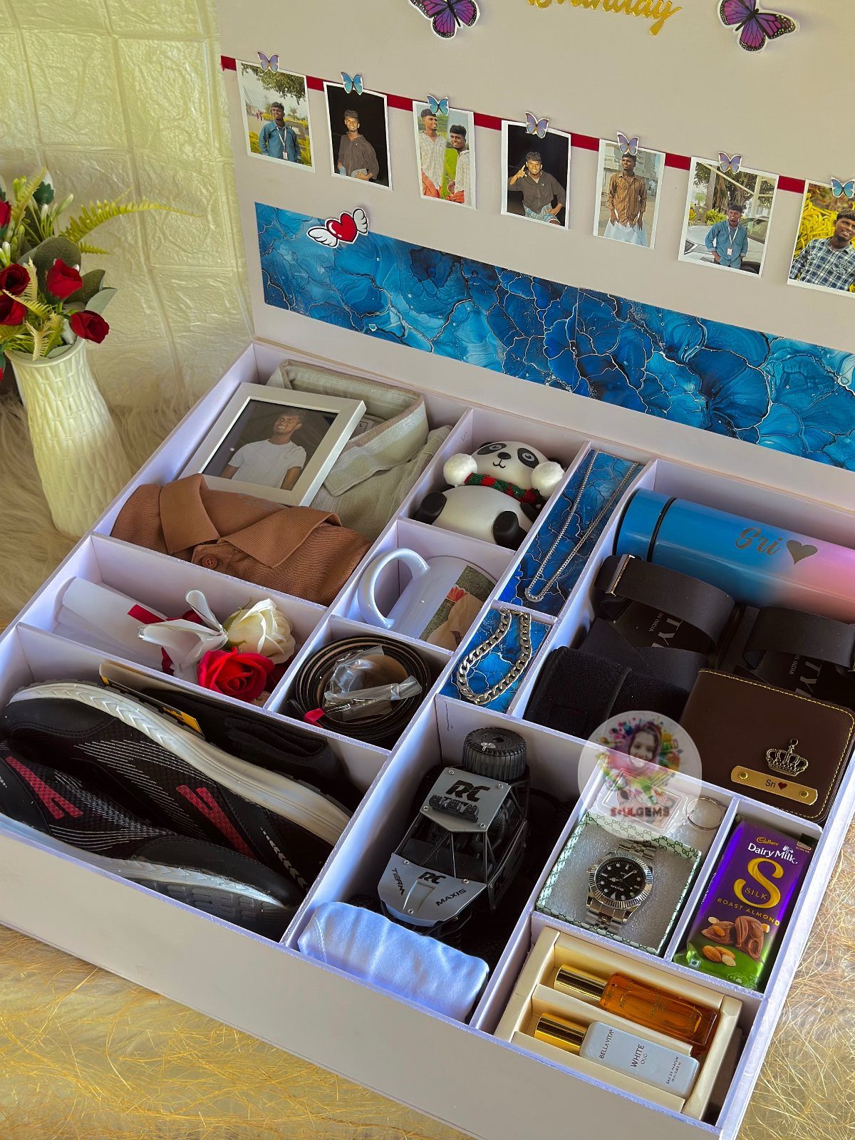 Curated gift box for a teen containing sneakers, watch, perfume, and personal photos