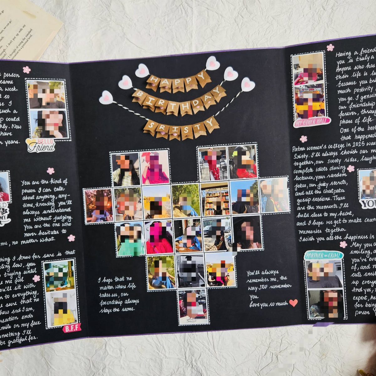 Open black scrapbook with photos, handwritten notes, and a birthday banner for Kristy.