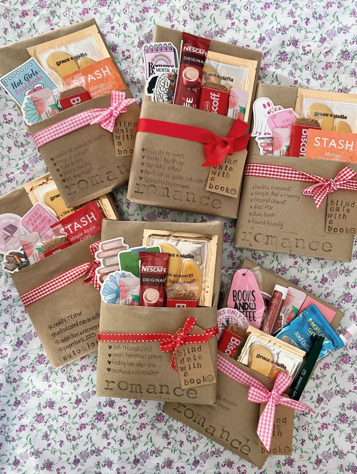 Brown paper gift bags containing books and treats tied with red ribbons.