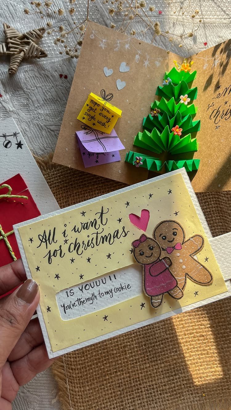 Handmade Christmas card with gingerbread people and a pop-up tree card background