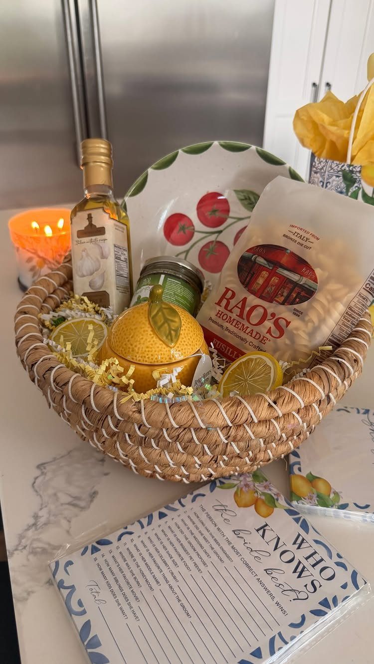 Woven gift basket with pasta, olive oil, and lemons for a bridal shower.