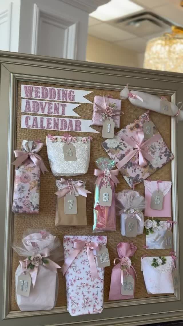 Wedding advent calendar with small floral and pink wrapped gifts on burlap background.