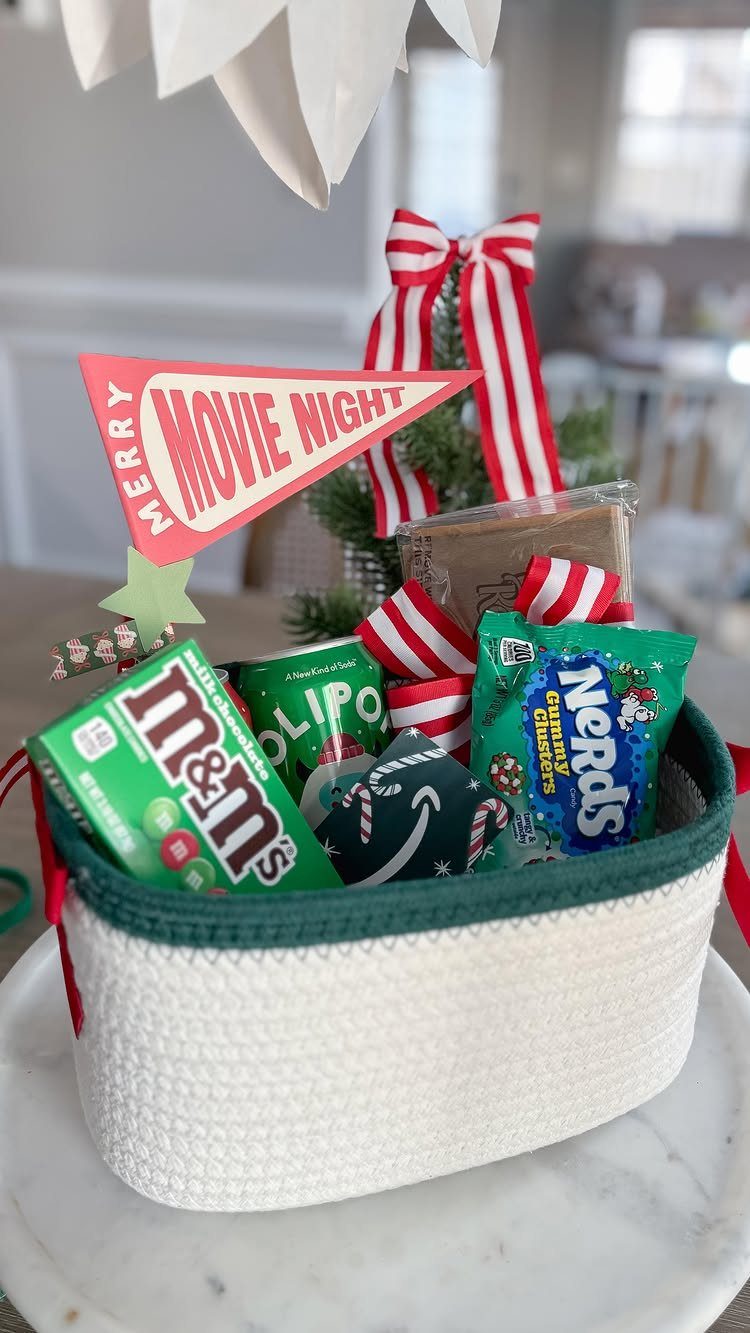 White woven basket filled with candies and a Merry Movie Night pennant flag.