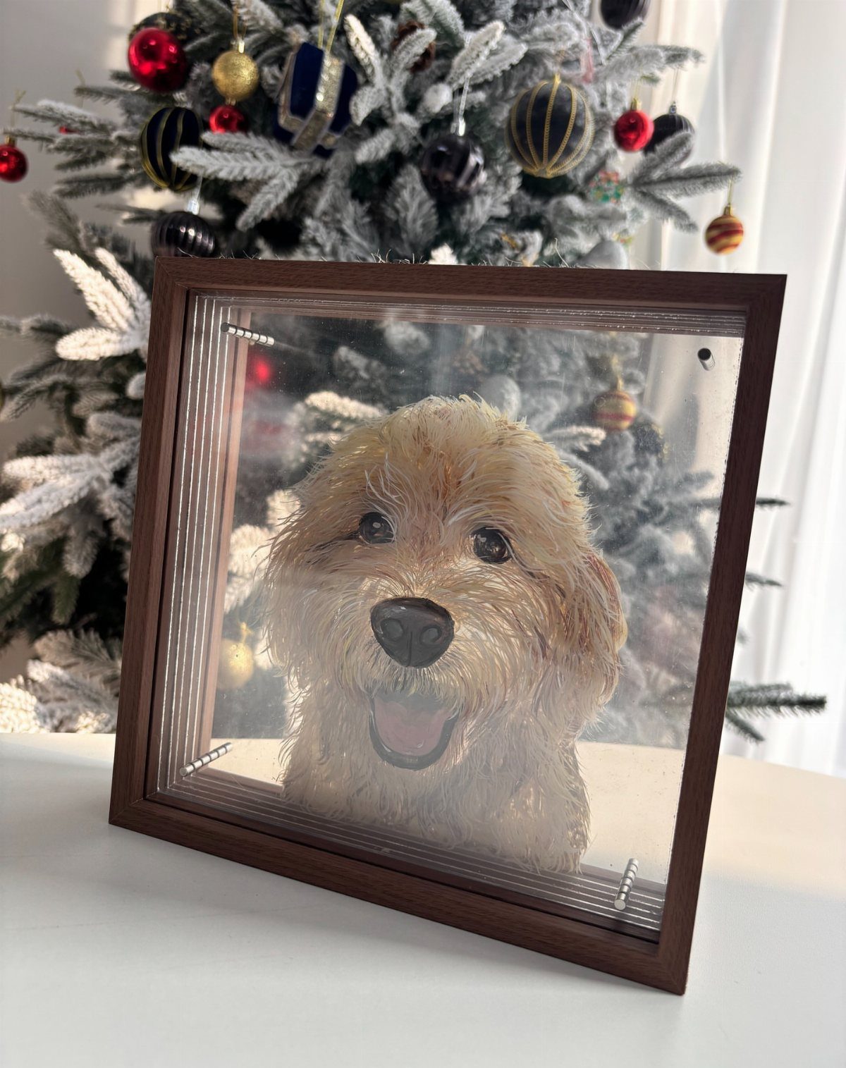 Framed custom portrait of a fluffy dog in front of a decorated Christmas tree