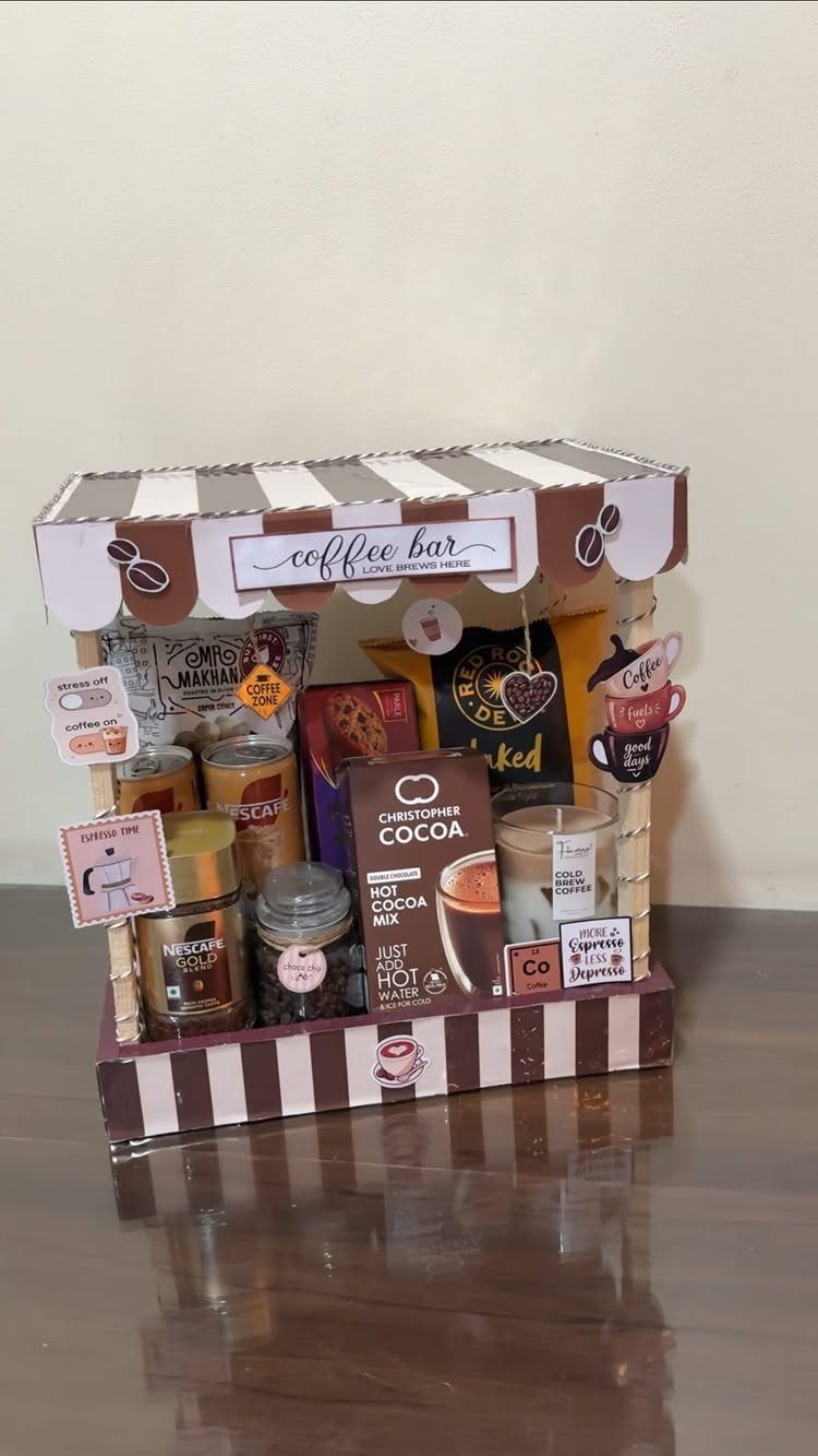 Miniature coffee bar gift set with cocoa mix and coffee jars in striped box