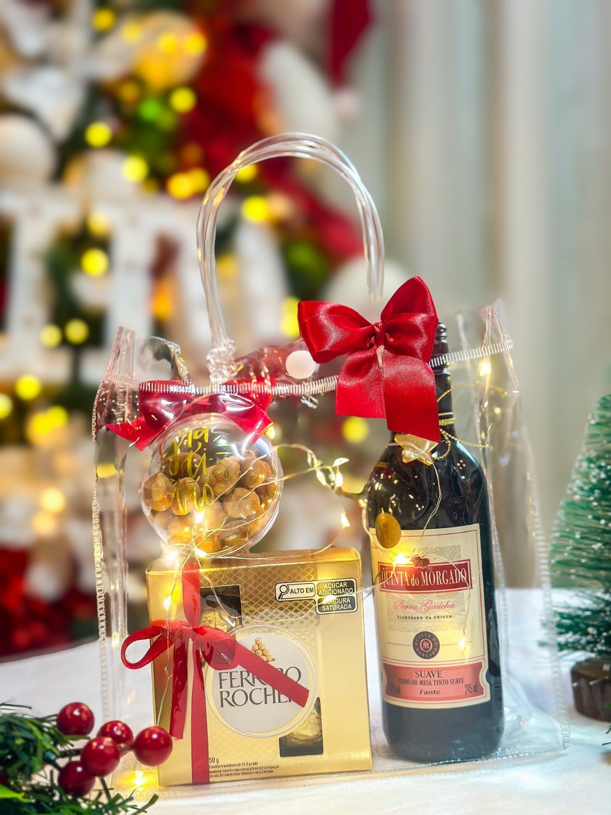Wine bottle and Ferrero Rocher chocolates in a festive clear gift bag.