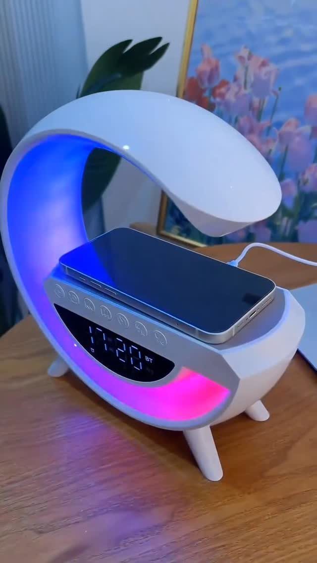 Modern white desk lamp with wireless phone charger and colorful LED lighting