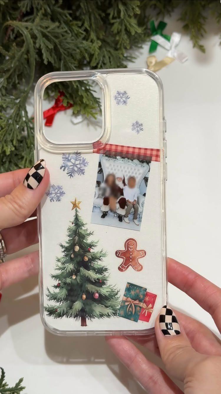 Clear phone case decorated with a family photo, Christmas tree, and holiday stickers.