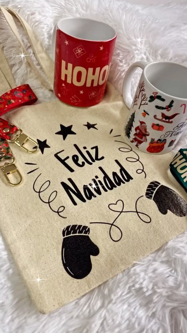 Beige canvas tote bag with Feliz Navidad text and Christmas mugs on white fur