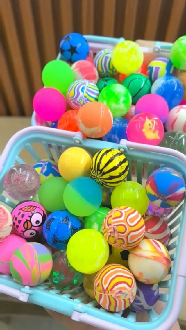 Colorful bouncy balls in light blue baskets as potential Christmas stocking stuffers.