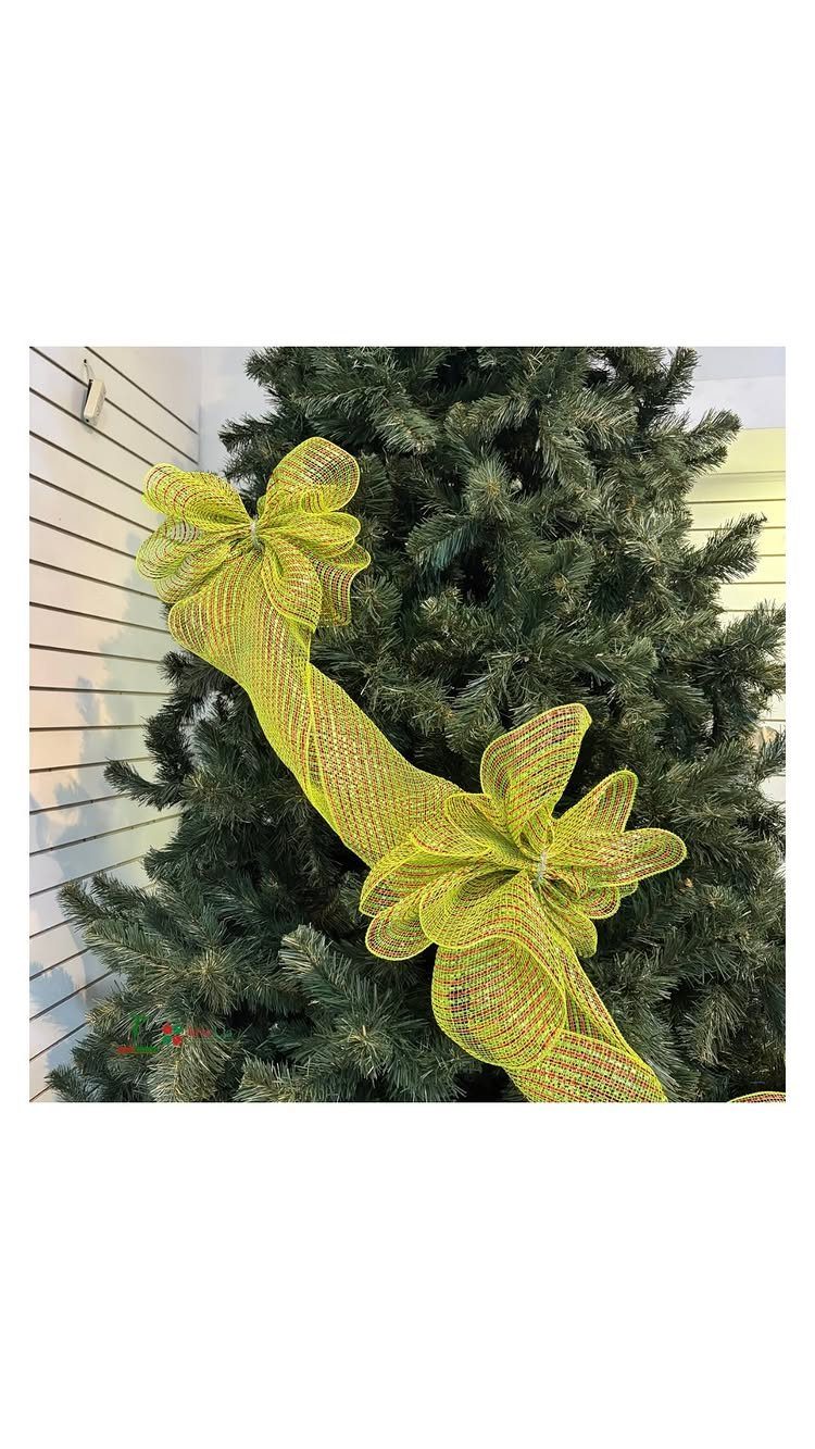Lime green mesh ribbon forming large billows and bows on a Christmas tree