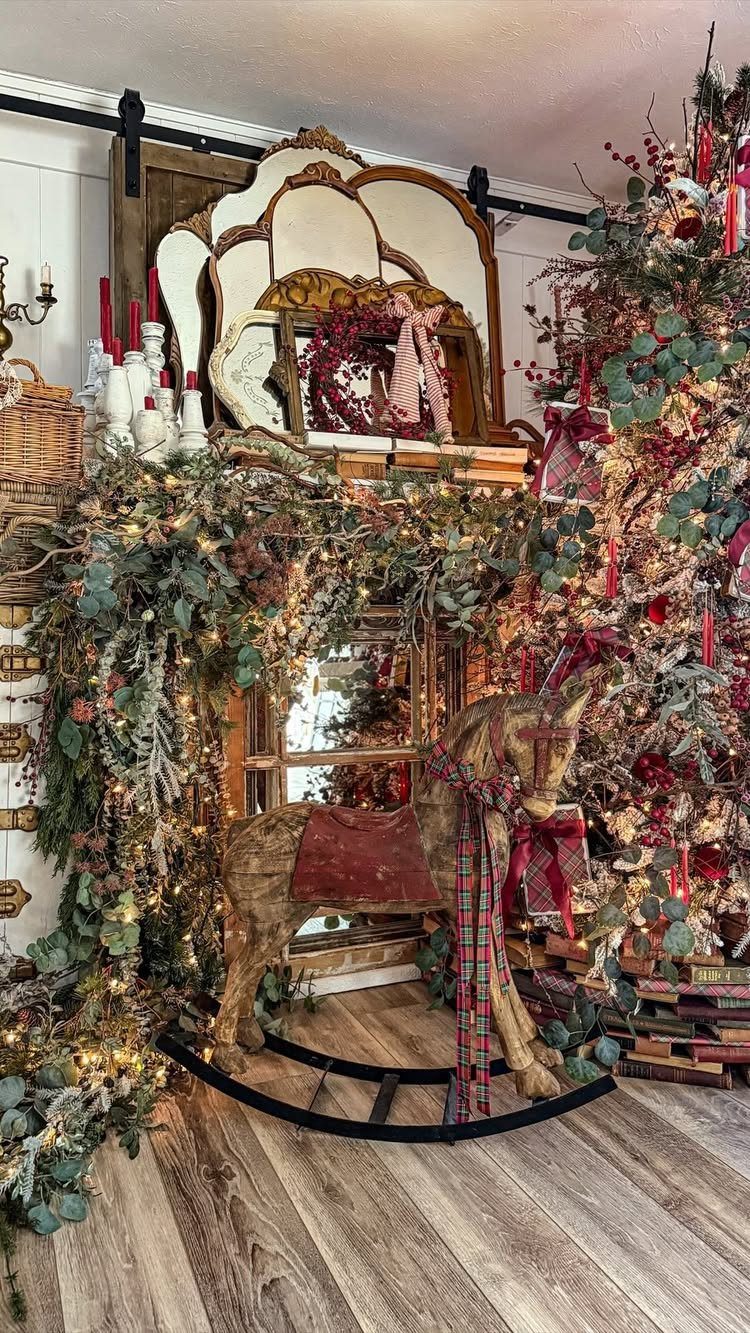 Vintage rocking horse with plaid ribbon surrounded by Christmas garlands and a decorated tree.