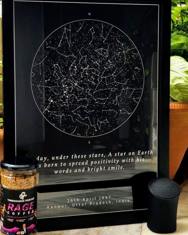 Framed custom star map with constellations and personalized text on a black background.