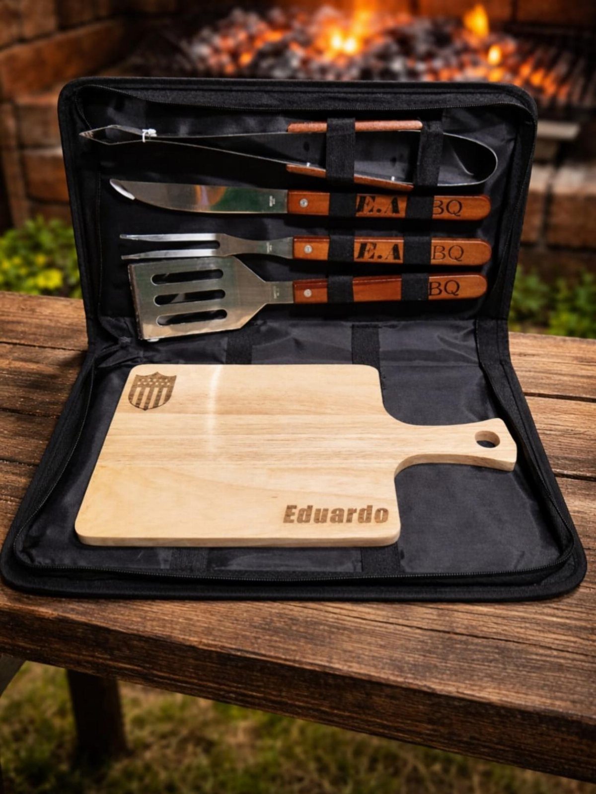 Grill tool kit with wooden handles and engraved cutting board in black case