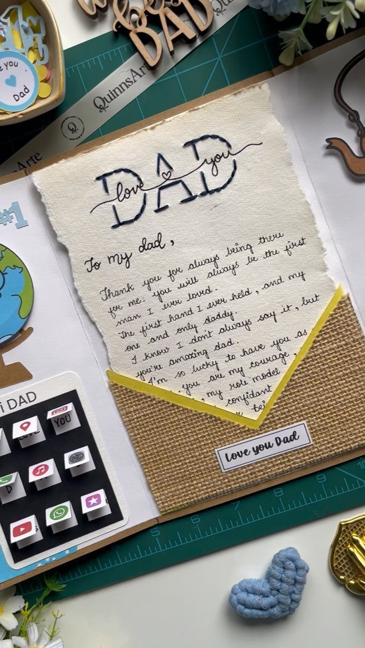 Handwritten letter to a father in a burlap pocket on a scrapbook page.