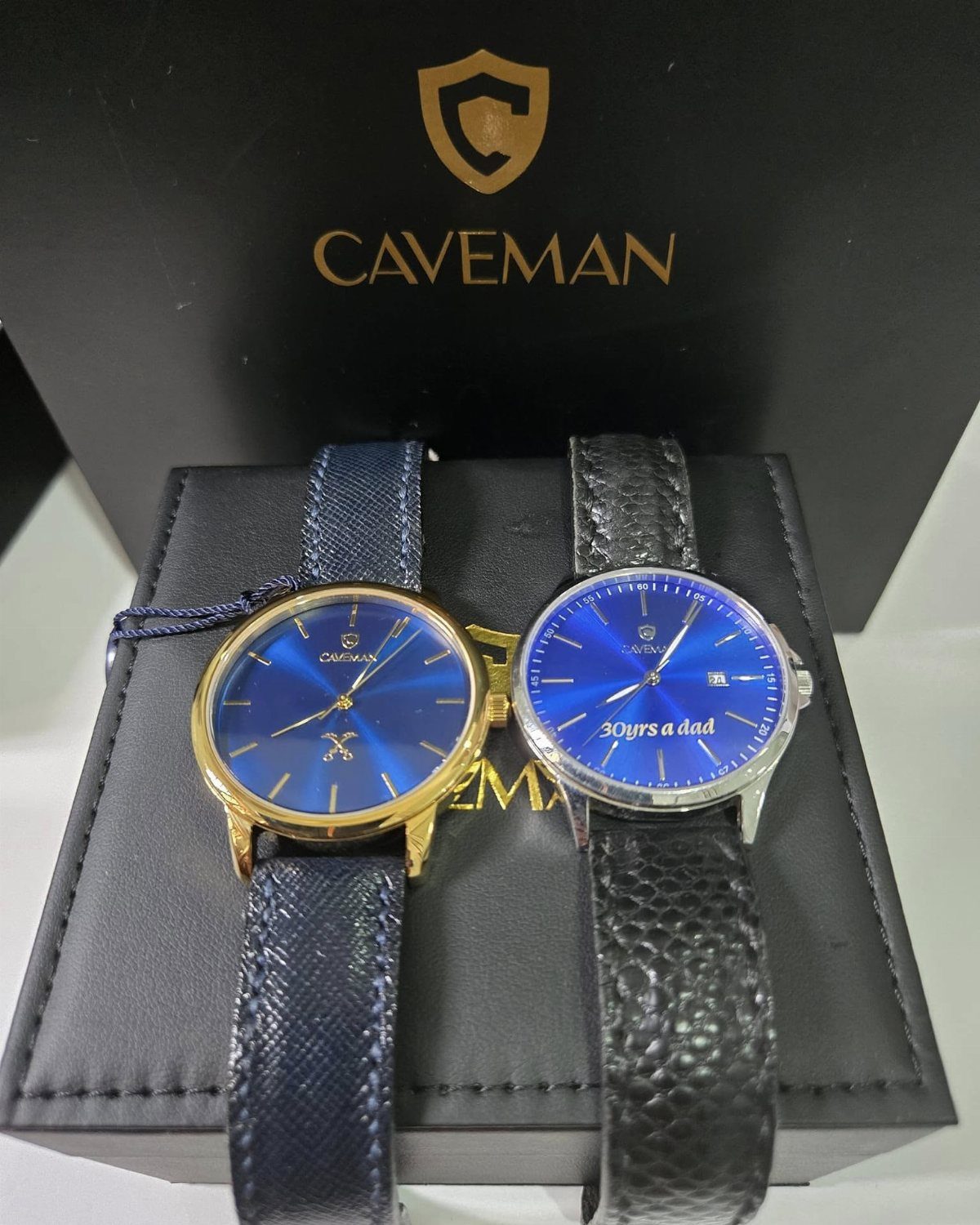 Two blue-faced wristwatches with leather straps, one engraved with 30yrs a dad.