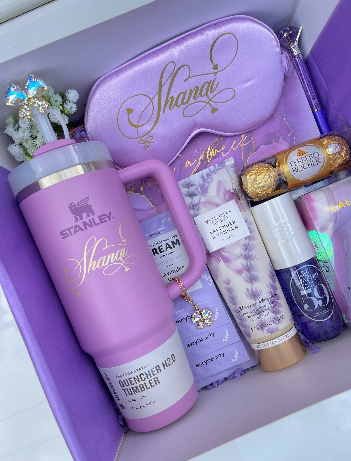Purple themed personalized gift box containing a tumbler, sleep mask, and beauty products.
