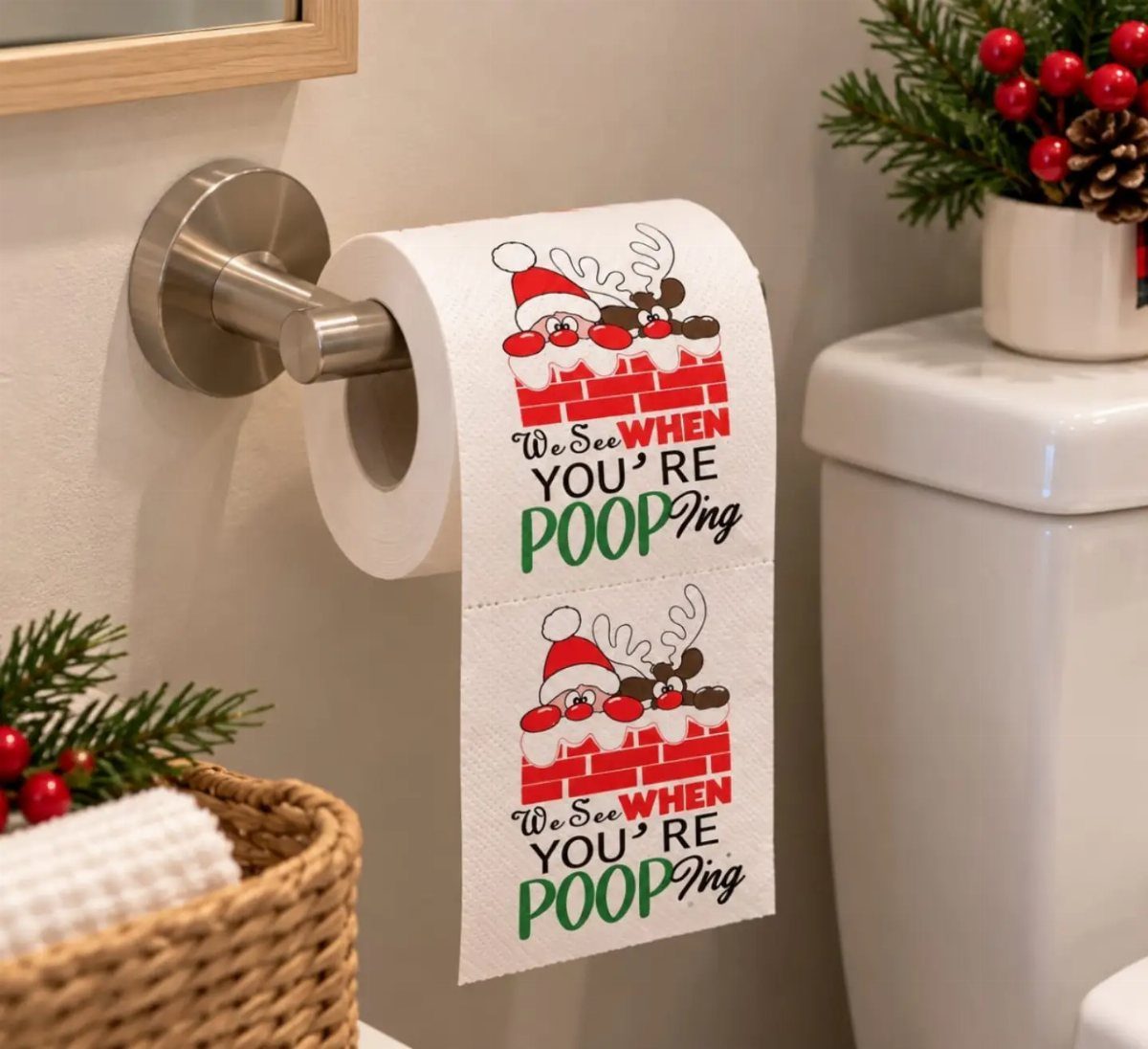 Toilet paper with a funny Christmas poop-themed print hanging in a bathroom.