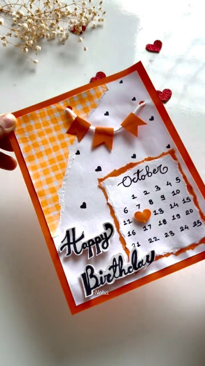 Handmade birthday card with an October calendar, orange bunting, and Happy Birthday text.