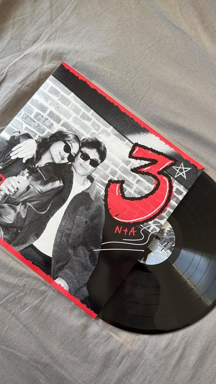 Custom vinyl record with a cover showing a couple and a red number 3.
