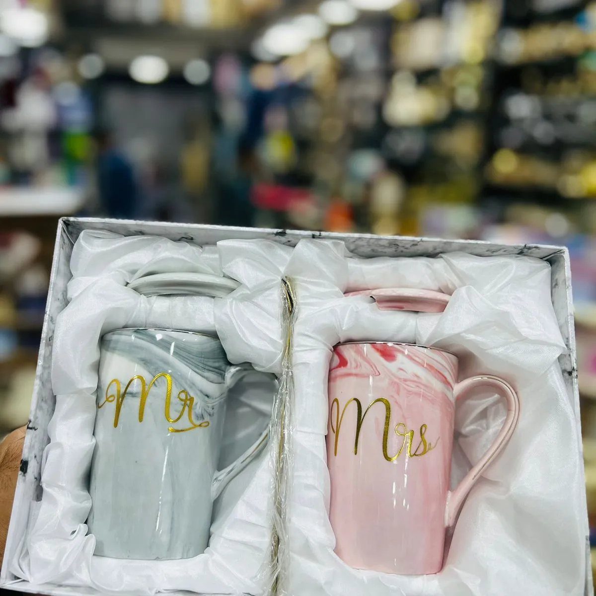 Two marbled stoneware mugs labeled Mr. and Mrs. in a gift box.