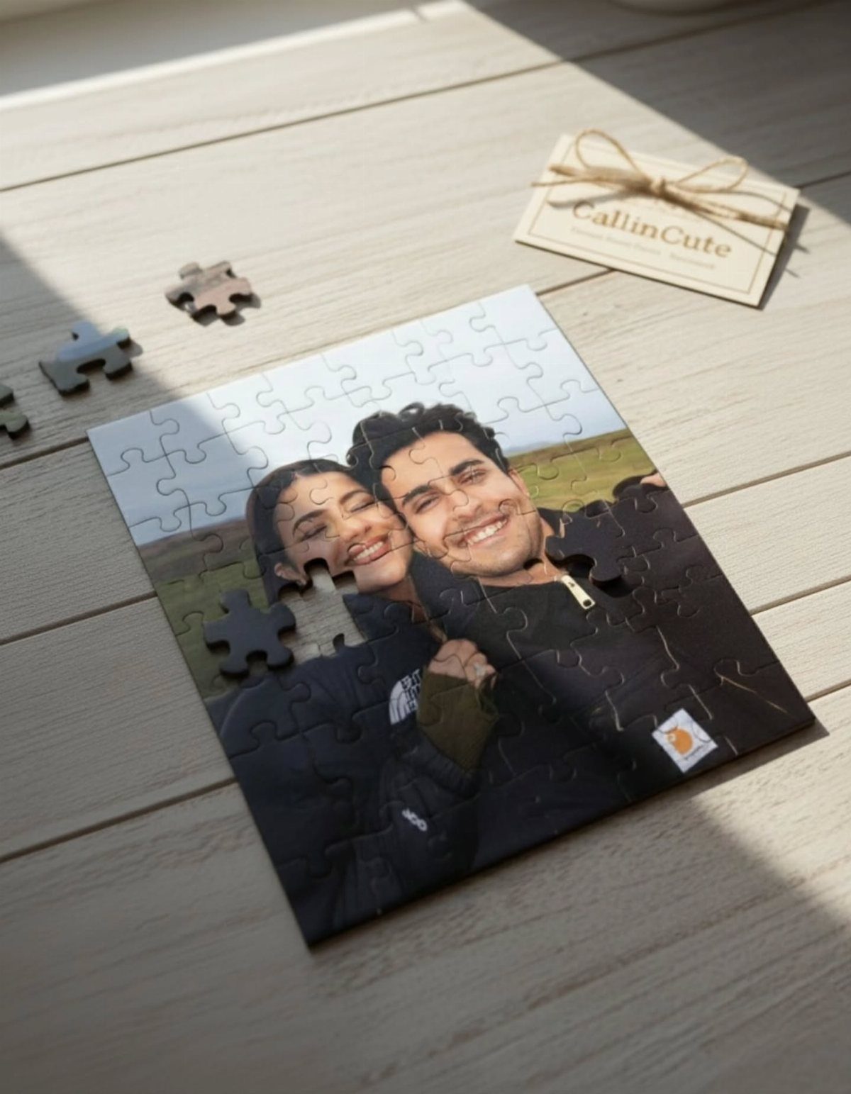 Custom jigsaw puzzle of a smiling couple on a light wooden table.