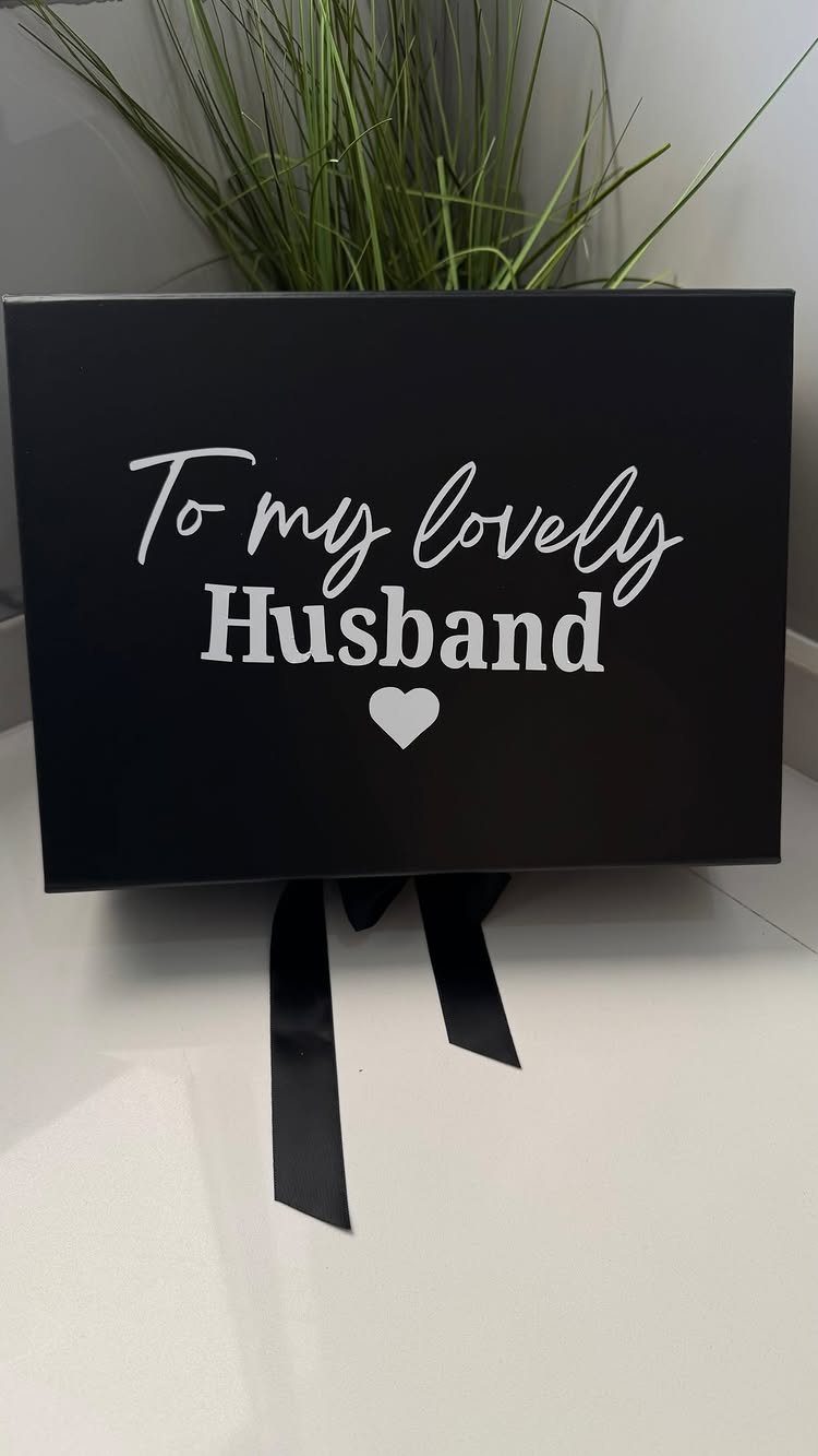 Black gift box with white text saying To my lovely Husband and heart.