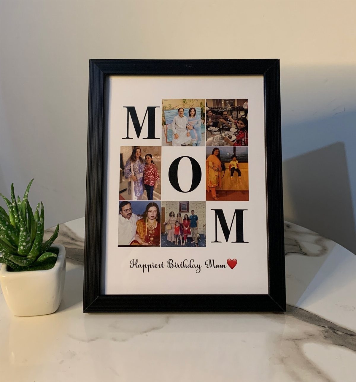 Black picture frame with a photo collage spelling MOM for a birthday gift.