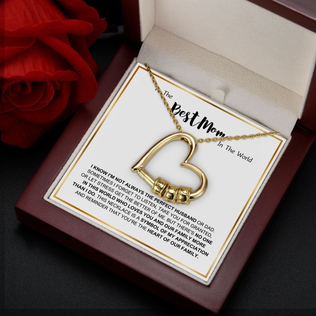 Gold heart-shaped necklace in a jewelry box with a Best Mom card