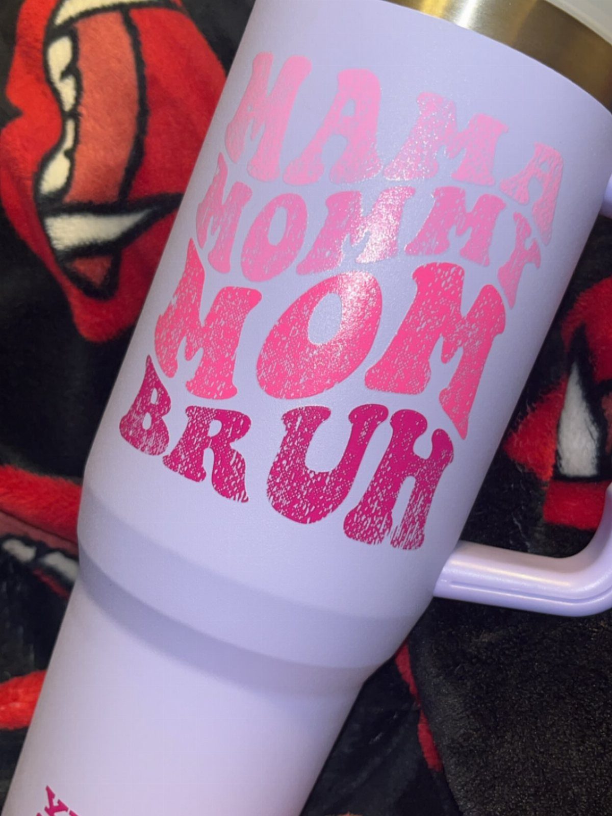 Light purple tumbler with pink glittery text reading Mama Mommy Mom Bruh.