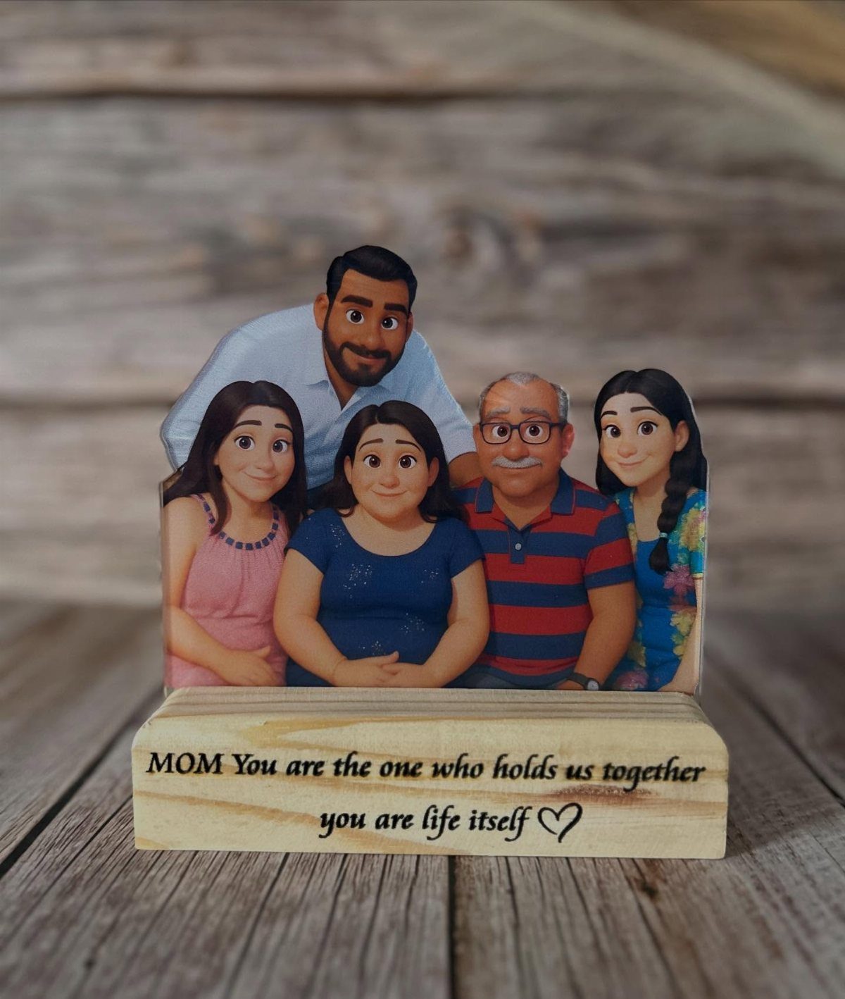 Cartoon family cutout on a wooden block with an engraved message for Mom.