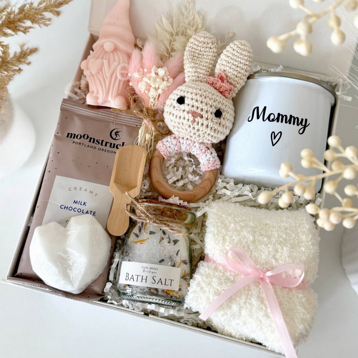 Gift box for a new mother with a Mommy mug and bunny rattle.