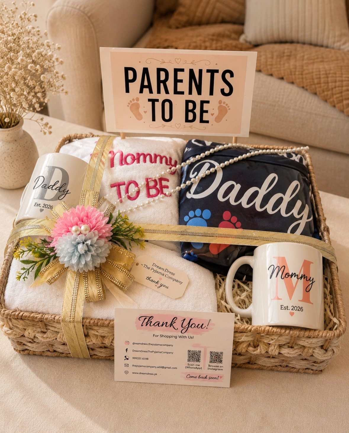 Gift basket for parents-to-be with personalized mugs and matching Mommy and Daddy t-shirts.