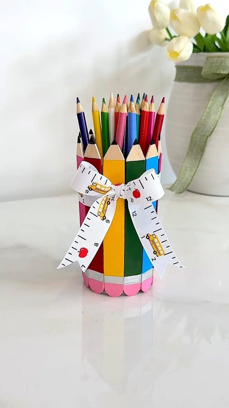 Pencil holder made of large colorful pencils tied with a school-themed ribbon.