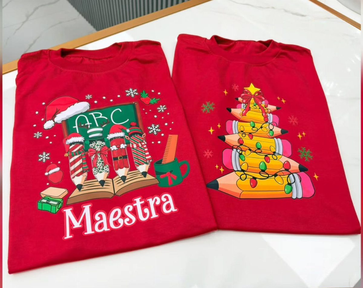 Two red t-shirts with Christmas-themed teacher graphics featuring pencils and school supplies.