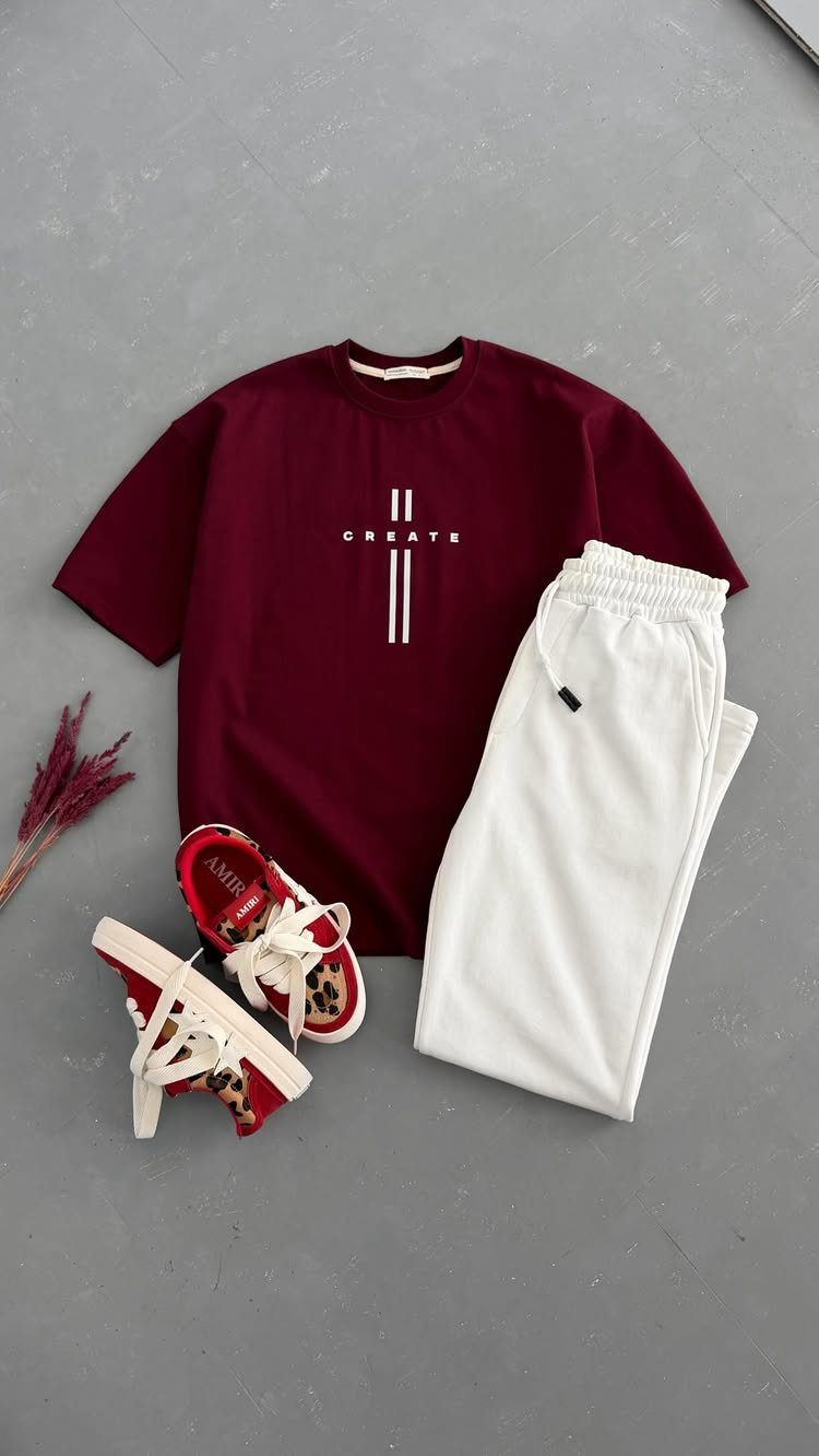Maroon t-shirt, white sweatpants, and red sneakers arranged as a coordinated gift set.