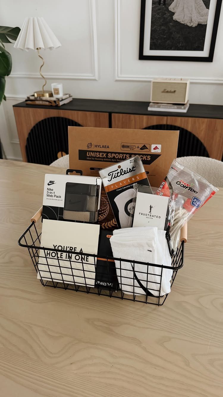 Golf gift basket with Titleist balls, white socks, and a hole-in-one card.