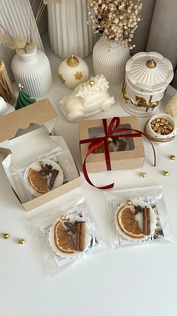 Handmade wax melts with orange and cinnamon in gift boxes for Christmas.