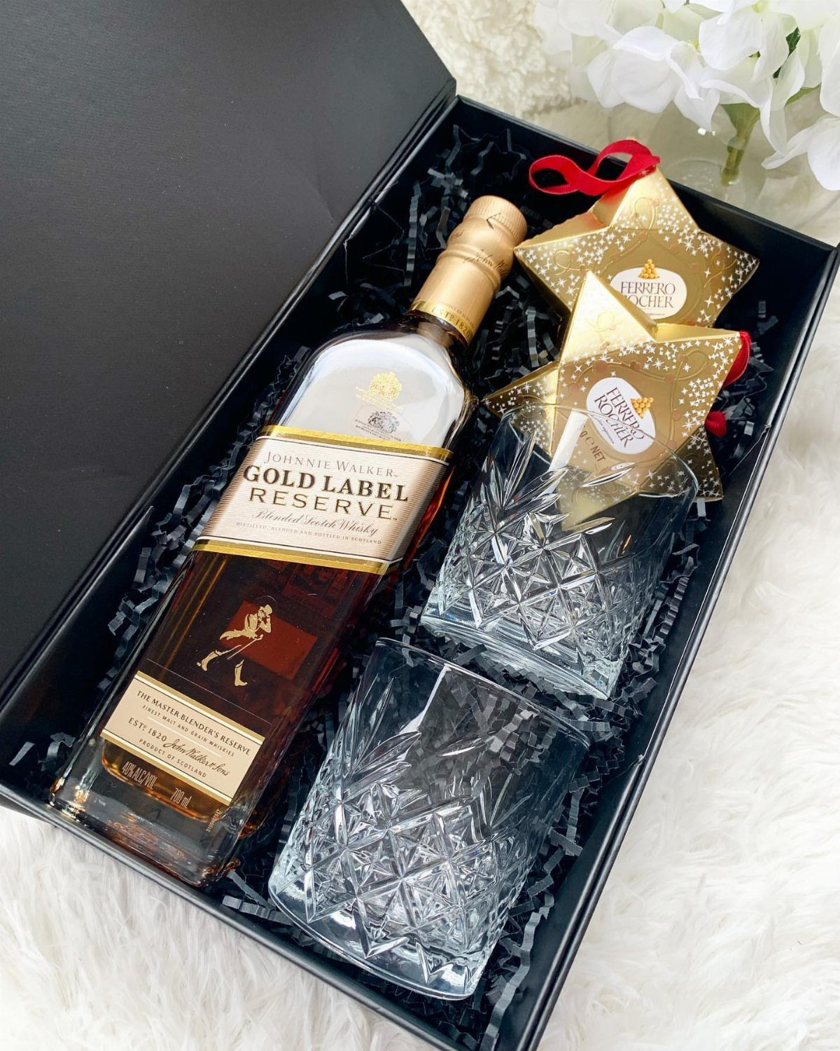Johnnie Walker Gold Label Reserve whisky bottle with two crystal glasses in a gift box